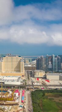 sunny day macay city famous hotel area construction aerial vertical panorama 4k timelapse china 