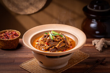Stir-fried beef slices, old kitchen interior wooden table background