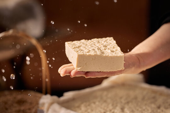 The Artisanal Process of Creating Tofu and Soy Milk by Hand,Critical Moment:Curding Soy Milk to Form Tofu