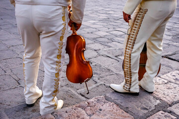San Miguel de Allende, Mexico - February 8, 2025: Detail of a mariachi musicians with a violin in San Miguel de Allende, Guanajuato, Mexico.