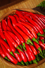 Fresh Red Sichuan Chili Peppers in Wooden Basket - Spicy Asian Cooking Ingredients