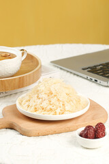 Organic White Fungus Silver Ear Mushroom Superfood from Fujian China on Wooden Plate