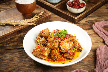 Fresh Fried Pork Chops with Garlic and Chili on Rustic Wooden Table