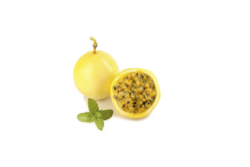 Golden passion fruit whole and halved with mint on white background - tropical Hainan fruit