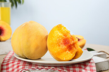 Fresh Yellow Fengxian Peaches on Plate - Juicy Hand-Picked Fruit Display