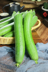 Freshly Picked Loofah Vegetables from Shouguang on Rustic Kitchen Table