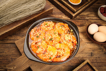 Garlic Shrimp in Cast Iron Skillet on Rustic Wooden Table with Fresh Ingredients