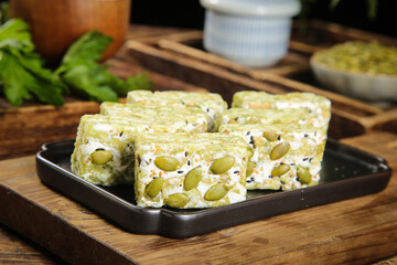 Matcha Pistachio Sachima Squares Traditional Asian Dessert on Wooden Board