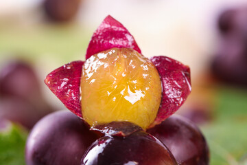 Fresh Grape Macro with Peeled Skin Revealing Golden Flesh - Artistic Food Photography