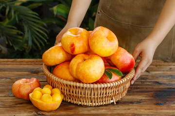 Fresh Shandong Peaches in Wicker Basket - Ripe Orchard Fruit with Sweet Orange Pulp