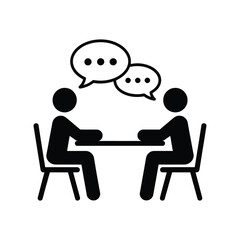 Two people having a conversation at a table with speech bubbles