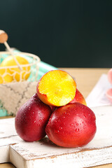 Fresh Red Nectarines from Shanxi Province China with Golden Yellow Heart Flesh on Wooden Table