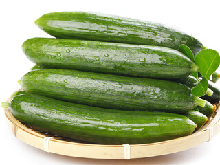 Fresh Green Cucumbers with Water Droplets in Bamboo Basket on White Background