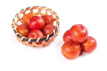 Fresh Red Plums with Water Droplets in Woven Basket on White Background - Guangdong Fruit