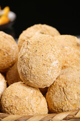 Fresh Coconuts with Fibrous Husks in Wicker Basket - Tropical Fruit Display