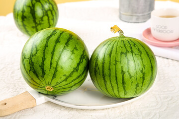 Fresh Hainan Watermelons - Premium Yellow Heart Selenium-Enriched Xiaofeng Variety on White Kitchen Counter
