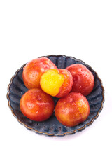 Fresh Red Plums with Water Droplets in Ceramic Bowl - Guangdong Organic Fruit on White Background