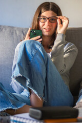 Teen wearing glasses and looking at the camera. Back-to-school concept. Online classes