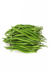 Fresh Green Chili Peppers Pile on White Background