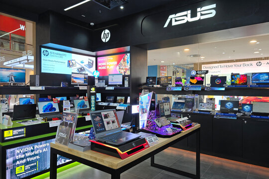 Penang, Malaysia &ndash; Sept 6, 2025: A tech retail shop showcasing HP, ASUS, and MSI laptops with NVIDIA GeForce RTX branding and promotional digital displays.