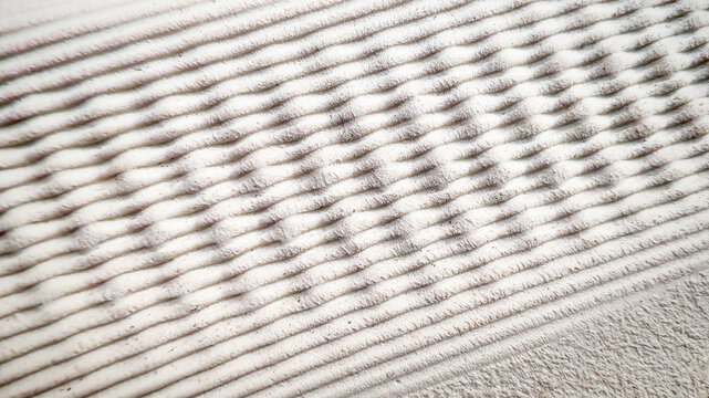 Detailed Close-up of a White Shoe Midsole with a Ribbed Texture, Highlighting the Soft and Elastic Cushioning Technology.