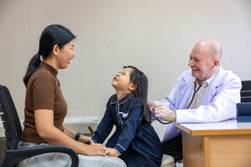 Caucasian doctor is diagnosis young girl using stethoscope for lung checkup and side effect on...