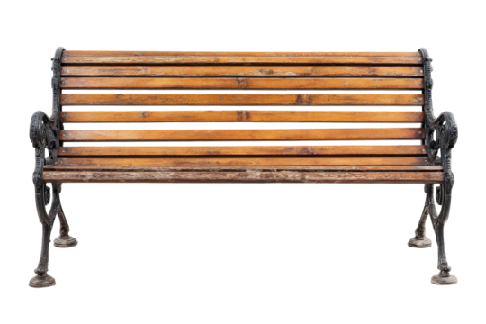 Vintage wooden park bench with ornate cast iron legs isolated on a white background.