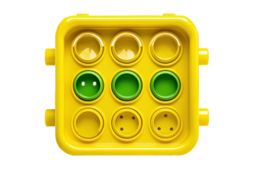 Yellow plastic toy block with green circular inserts.