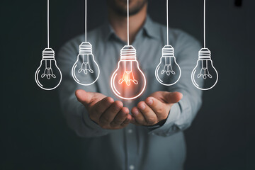 Idea Generation in Hand: A person cradles a glowing lightbulb among several others, representing the generation and nurturing of a unique idea in a concept of innovation and creativity. 