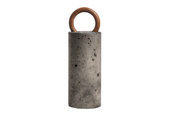 Old industrial concrete cylinder weight with a rusty metal ring.