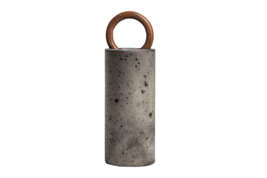 Old industrial concrete cylinder weight with a rusty metal ring.