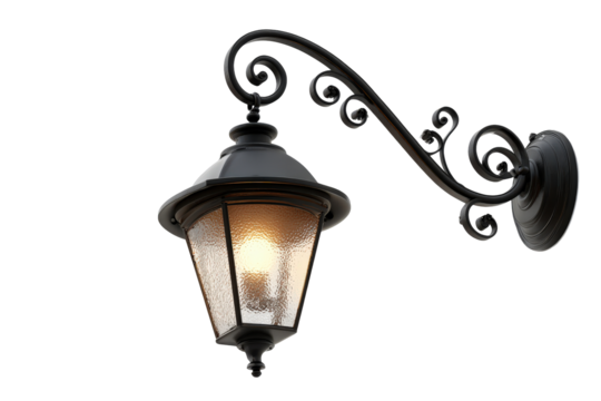 Vintage black wrought iron street lamp glowing warmly.