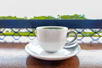 Bright Refreshing Matcha Latte Art Served in a Ceramic Cup Drink