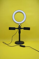Photography Ring Light on yellow Background for Professional Lighting Setup