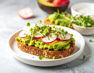 Healthy avocado toast with radish slices and sprouts