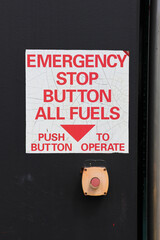 Emergency Stop Button All Fuels sign at a petrol gas service station