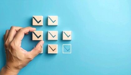 hand interacting with wooden blocks showing check marks and square outlines on blue background