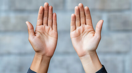 Hands raised in celebration, showcasing diversity and unity