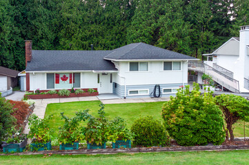A perfect neighbourhood. Family residential house with canadian flag