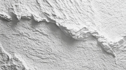Aerial view of a stark white textured landscape with rough terrain and jagged edges visible