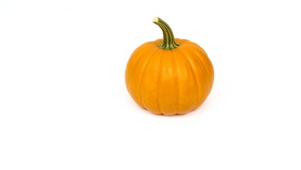 Obraz premium A single ripe orange pumpkin with a green stem on a white background