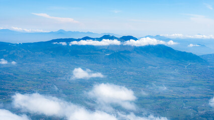 Mountain Range with Scattered Clouds