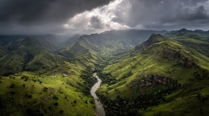 Aerial View Of Lush Green Valley With River And Mountains
