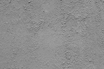 Close-up of a grey weathered cement wall.