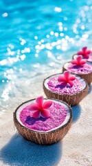Exotic pink drinks in natural coconut shells, elegantly presented on a pristine sandy beach by crystal clear water