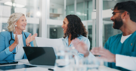 Doctor, woman and people in hospital, applause and medical planning with solution. Clapping, healthcare and employees with conversation, medicine achievement or clinic results with success or smile