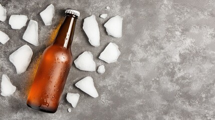 A Refreshing Cold Beer Bottle with Ice Chunks on a Textured Gray Surface