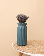 Vase with dry lavender on a table