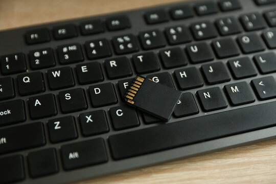 SD memory card on computer keyboard