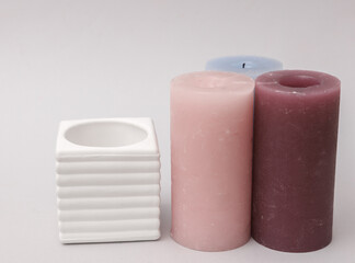 Concrete mold with candles on gray background